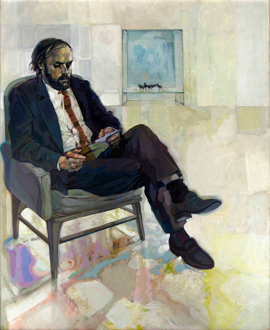 A man sitting in a chair with a book. A man sitting in a chair with a book.